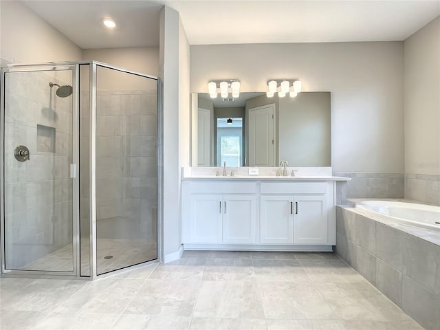 bathroom with a stall shower, a bath, double vanity, and tile patterned floors