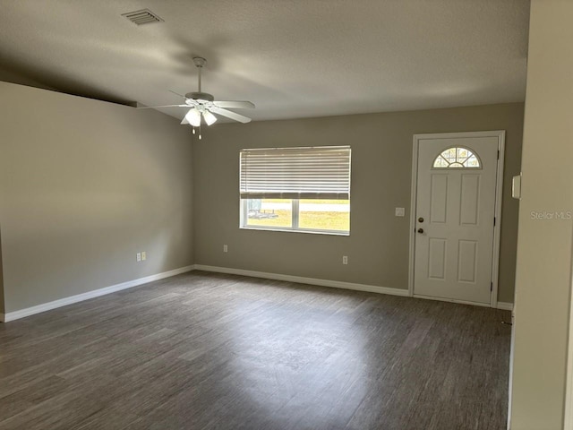 4046 E Bennett St, Inverness, FL 34453 - foyer entrance with a ceiling fan, visible vents, dark wood-style floors, and a wealth of natural light