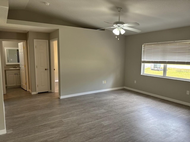 4046 E Bennett St, Inverness, FL 34453 - spare room with baseboards, ceiling fan, and dark wood-type flooring