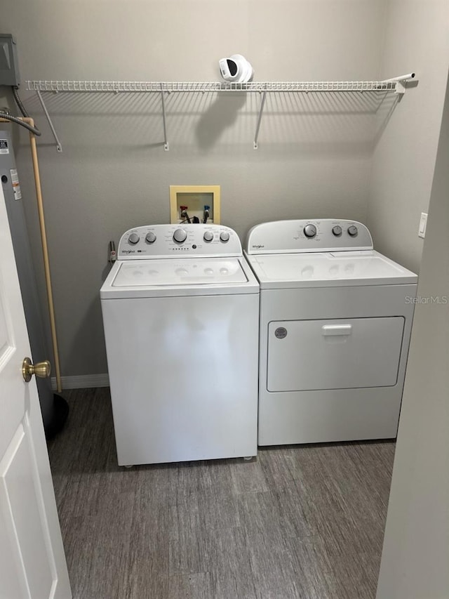 4046 E Bennett St, Inverness, FL 34453 - washroom with baseboards, laundry area, wood finished floors, and washing machine and clothes dryer