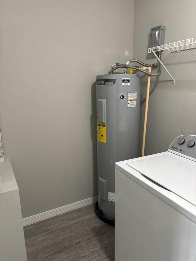 4046 E Bennett St, Inverness, FL 34453 - clothes washing area with laundry area, washer / dryer, baseboards, dark wood finished floors, and water heater