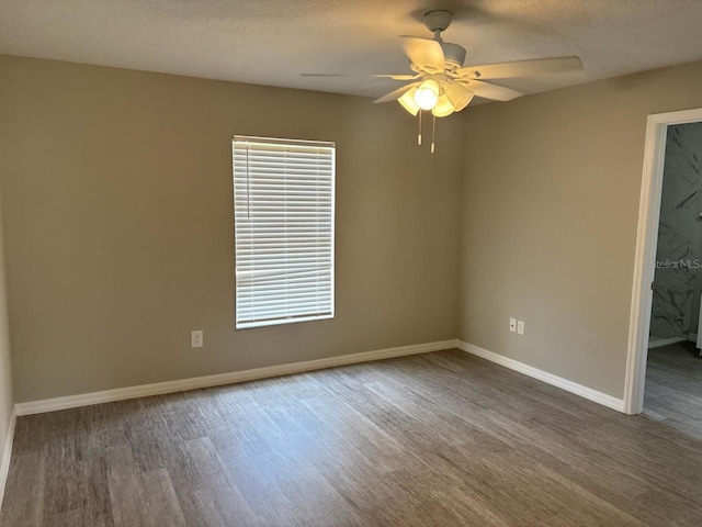 4046 E Bennett St, Inverness, FL 34453 - spare room with baseboards, a textured ceiling, ceiling fan, and wood finished floors