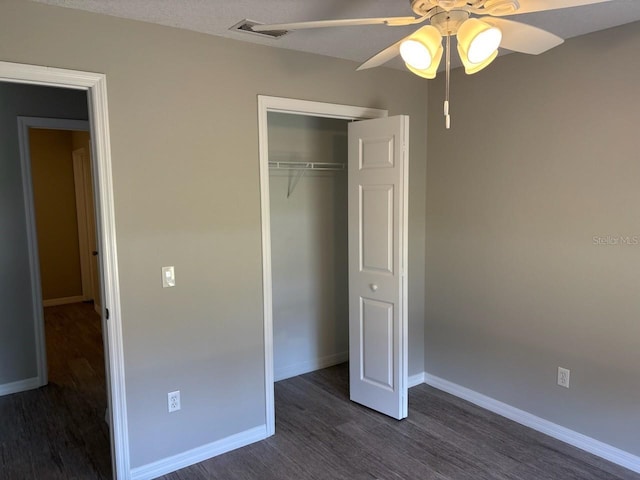 4046 E Bennett St, Inverness, FL 34453 - unfurnished bedroom with visible vents, baseboards, dark wood-type flooring, and a closet