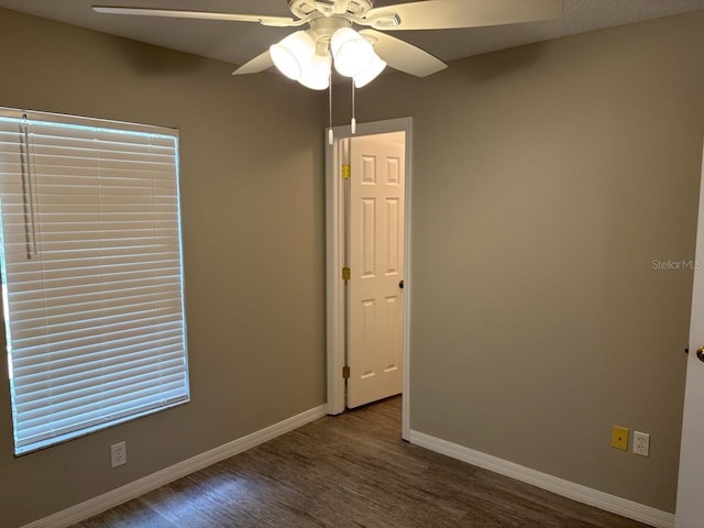 4046 E Bennett St, Inverness, FL 34453 - empty room with baseboards, ceiling fan, and wood finished floors