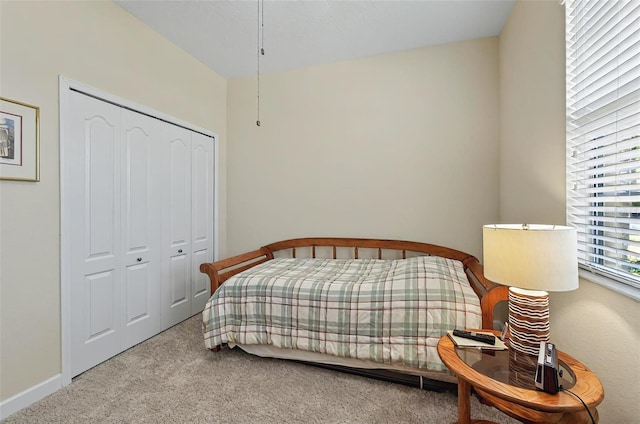 carpeted bedroom featuring a closet