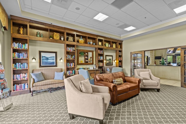 interior space with ornamental molding, visible vents, and carpet