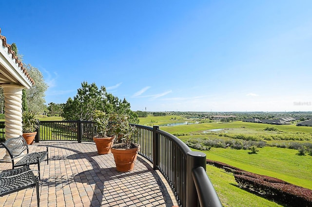 wooden terrace with a water view