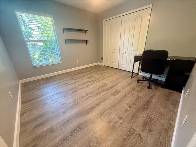 office area featuring wood finished floors and baseboards