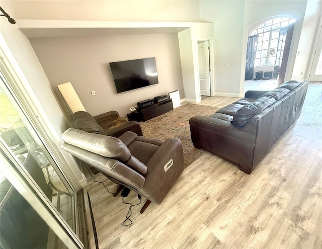 living room with light wood-style floors and baseboards