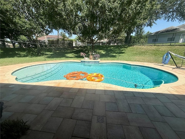 view of swimming pool with a patio