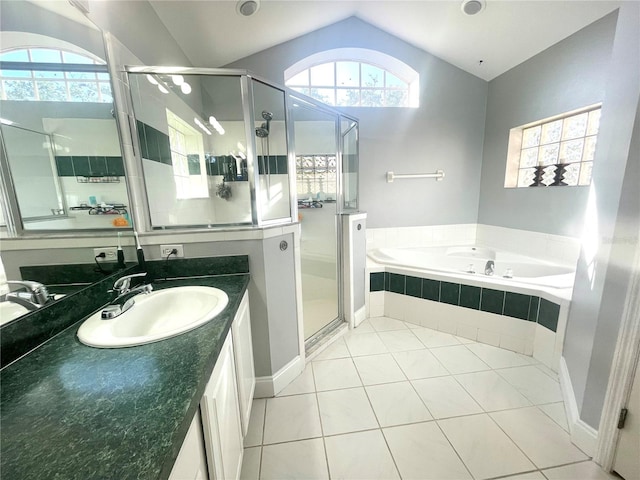 full bath with lofted ceiling, a stall shower, a bath, vanity, and tile patterned floors