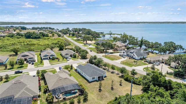 bird's eye view featuring a residential view and a water view