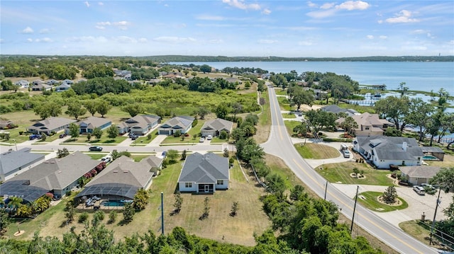 birds eye view of property with a water view and a residential view