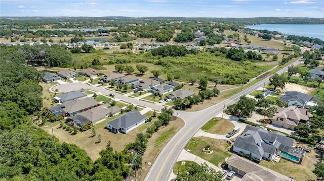 bird's eye view with a water view and a residential view