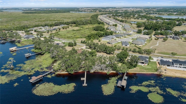 bird's eye view with a residential view and a water view