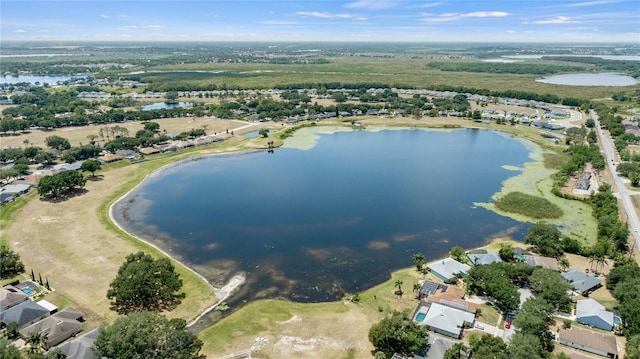 birds eye view of property with a water view and a residential view