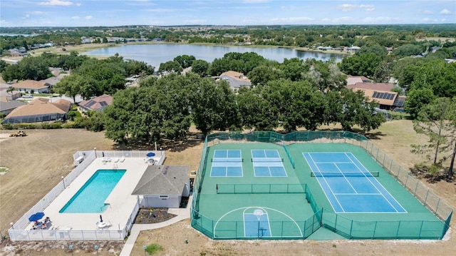 birds eye view of property with a water view