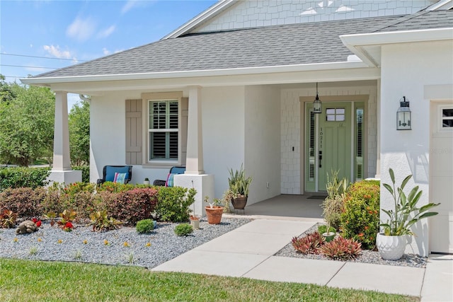 property entrance featuring a shingled roof and a porch