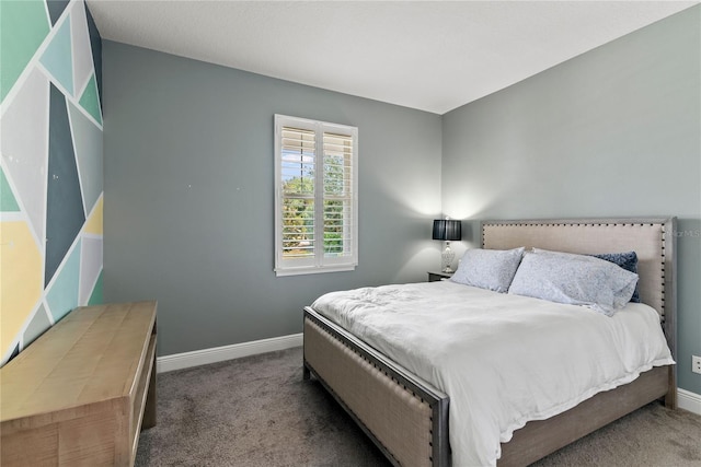 bedroom with baseboards and carpet