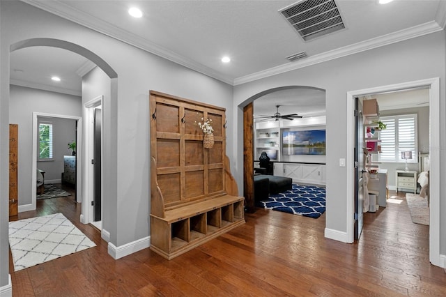 mudroom with visible vents, arched walkways, a ceiling fan, and wood finished floors