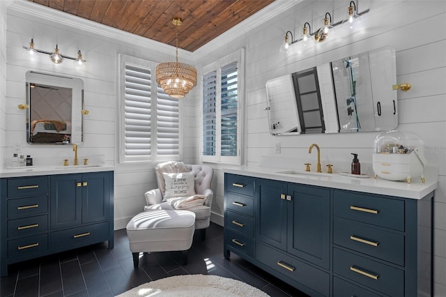 bathroom featuring a sink, tile patterned floors, crown molding, and wood ceiling