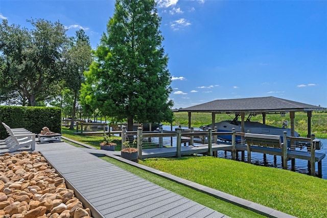 dock area featuring a lawn, a water view, and boat lift