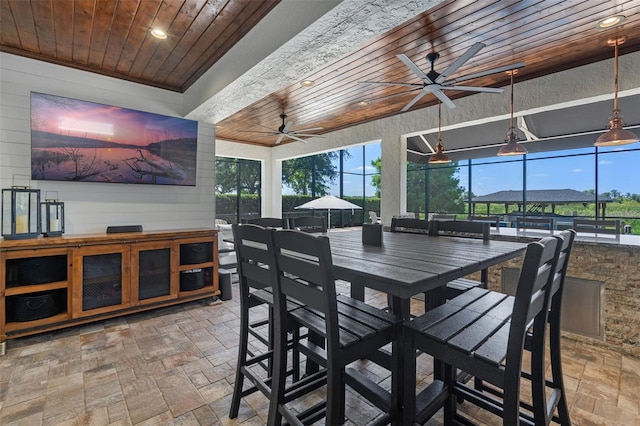 dining space with a ceiling fan, recessed lighting, wood ceiling, and stone tile flooring