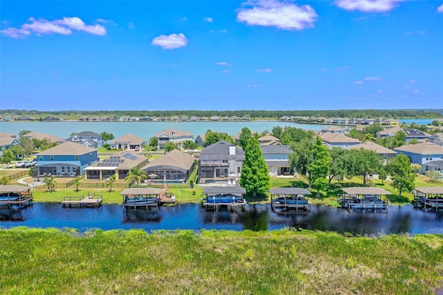 aerial view with a water view and a residential view