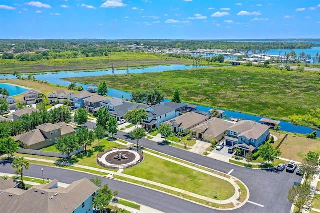 bird's eye view featuring a residential view and a water view