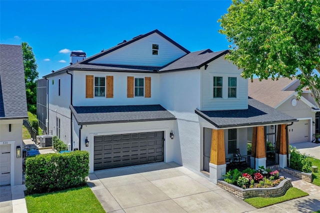 722 Barefoot Bay Loop, Groveland, FL 34736 - view of front facade with a shingled roof, concrete driveway, an attached garage, and stucco siding