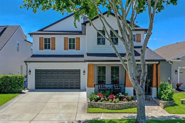 722 Barefoot Bay Loop, Groveland, FL 34736 - view of front facade featuring covered porch, concrete driveway, a garage, and roof with shingles