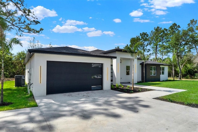 view of front of house featuring concrete driveway, an attached garage, central AC unit, and stucco siding