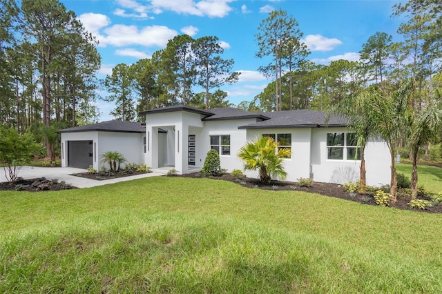 42191 Cashew St, Eustis, FL 32736 - view of front of house featuring stucco siding, driveway, an attached garage, and a front yard
