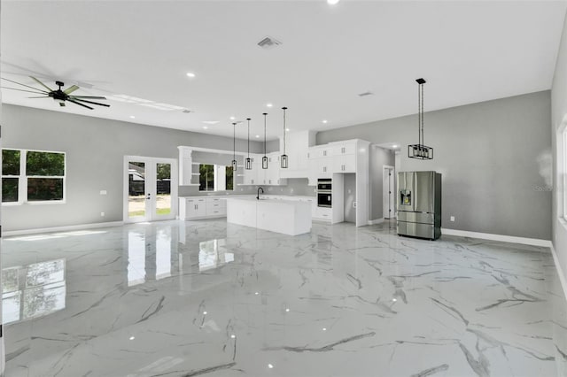 42191 Cashew St, Eustis, FL 32736 - unfurnished living room featuring french doors, a ceiling fan, recessed lighting, and light marble finish flooring