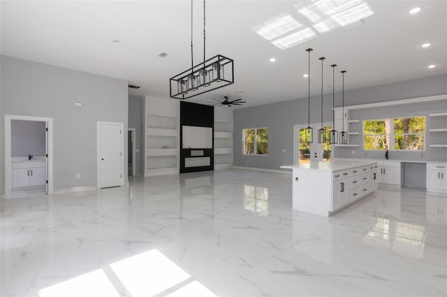 42191 Cashew St, Eustis, FL 32736 - unfurnished living room featuring recessed lighting, a towering ceiling, plenty of natural light, french doors, and built in features