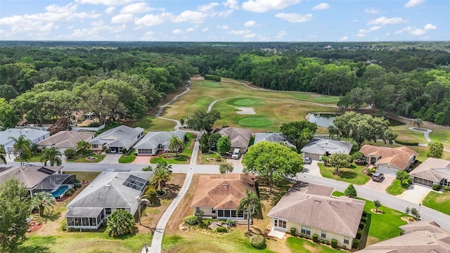 705 Grand Vista Trl, Leesburg, FL 34748 - birds eye view of property featuring view of golf course, a view of trees, and a residential view