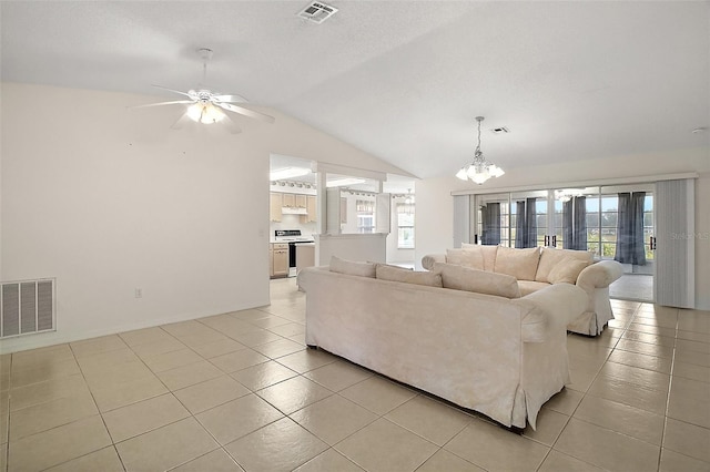 705 Grand Vista Trl, Leesburg, FL 34748 - living room with visible vents, ceiling fan with notable chandelier, a healthy amount of sunlight, and vaulted ceiling