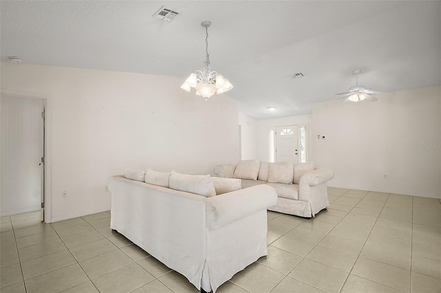705 Grand Vista Trl, Leesburg, FL 34748 - living area with visible vents, light tile patterned floors, and ceiling fan with notable chandelier