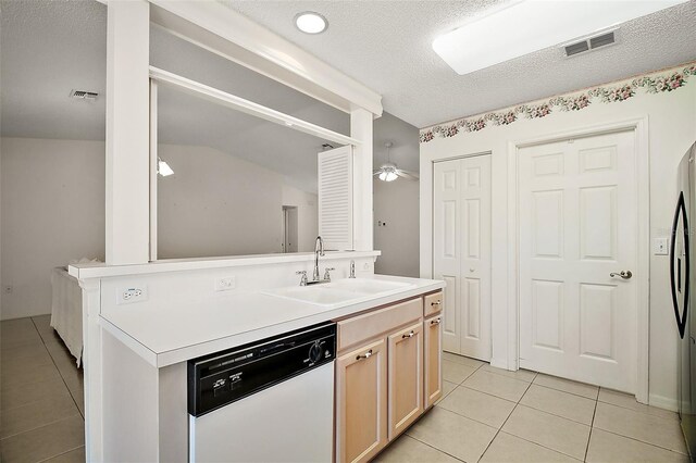 705 Grand Vista Trl, Leesburg, FL 34748 - kitchen with light tile patterned flooring, visible vents, a sink, and dishwasher