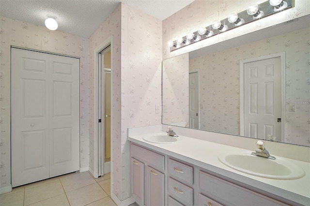 705 Grand Vista Trl, Leesburg, FL 34748 - bathroom with double vanity, tile patterned floors, a sink, and a closet