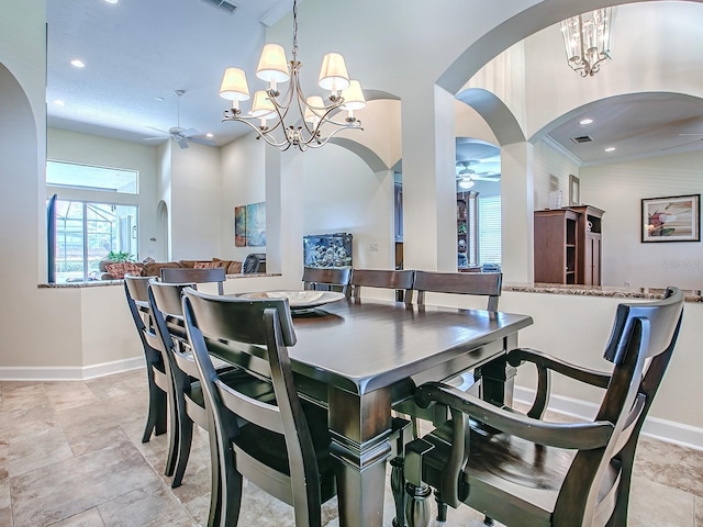 3775 Brantley Place Cir, Apopka, FL 32703 - dining room featuring a ceiling fan, baseboards, a chandelier, recessed lighting, and arched walkways