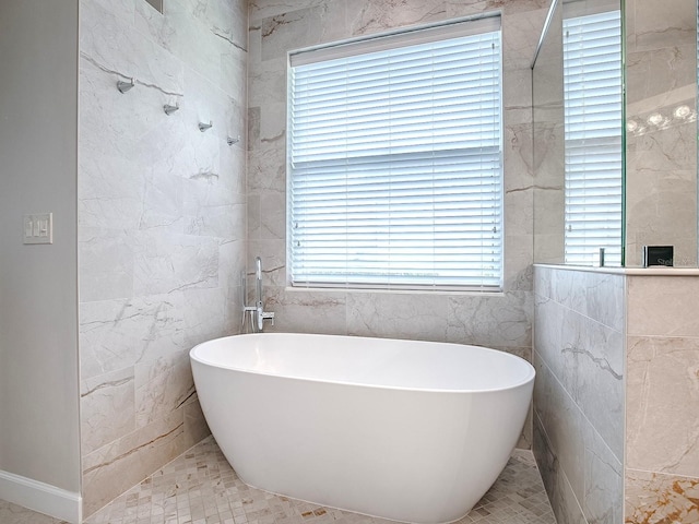 3775 Brantley Place Cir, Apopka, FL 32703 - bathroom with a freestanding tub and tile walls