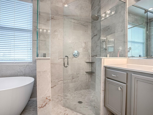 3775 Brantley Place Cir, Apopka, FL 32703 - full bath with a stall shower, a soaking tub, vanity, and tile walls