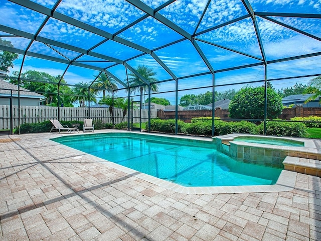 3775 Brantley Place Cir, Apopka, FL 32703 - view of swimming pool with a patio, glass enclosure, a fenced backyard, and a pool with connected hot tub