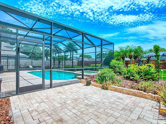 3775 Brantley Place Cir, Apopka, FL 32703 - view of pool featuring a fenced backyard, a patio, a pool with connected hot tub, and glass enclosure
