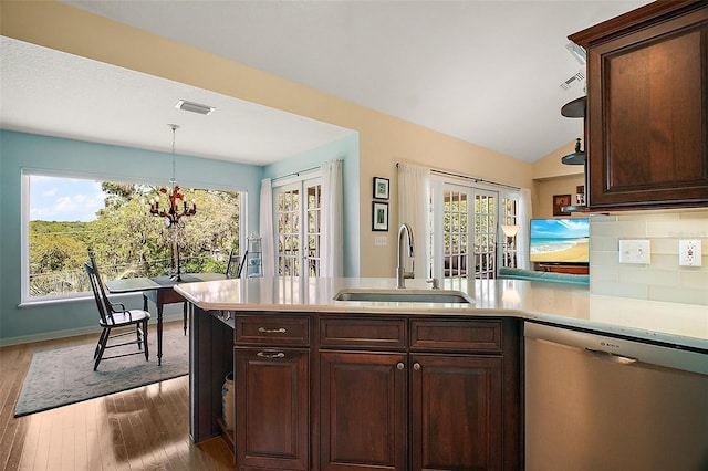 kitchen with a sink, light countertops, visible vents, and dishwasher