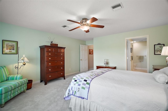 bedroom with a ceiling fan, baseboards, visible vents, and light carpet
