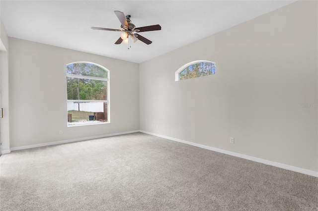 11344 Gallinule Ave, Weeki Wachee, FL 34613 - carpeted empty room featuring baseboards and ceiling fan