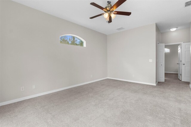 11344 Gallinule Ave, Weeki Wachee, FL 34613 - carpeted spare room featuring baseboards, a ceiling fan, and visible vents