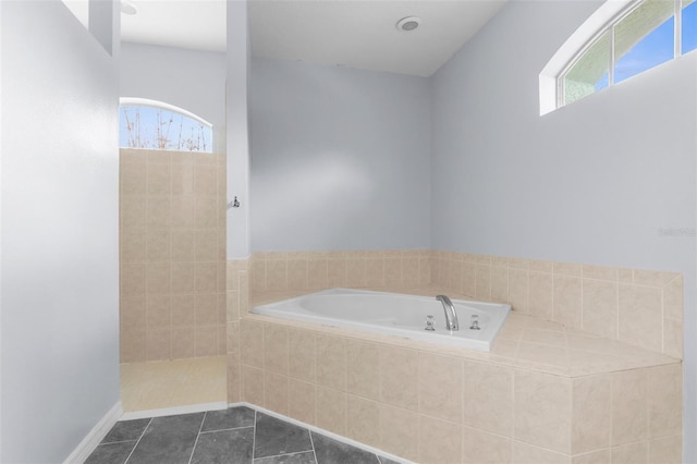 11344 Gallinule Ave, Weeki Wachee, FL 34613 - full bath featuring a bath and tile patterned flooring